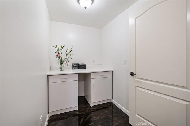 8865 San Gabriel Rd, Atascadero, CA 93422 - washroom featuring baseboards and dark marble finish floors
