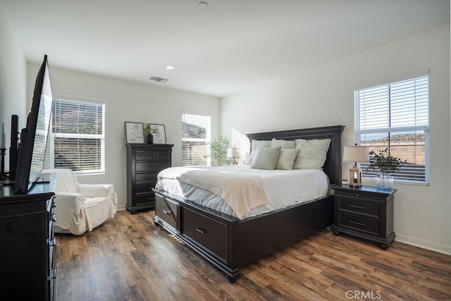 bedroom featuring dark hardwood / wood-style floors