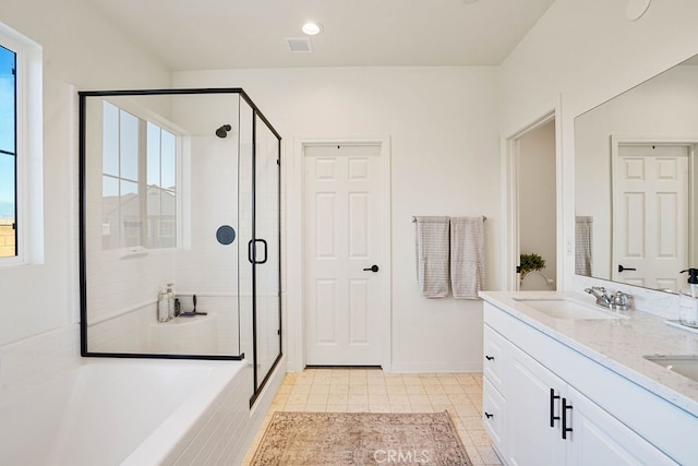 bathroom with vanity, separate shower and tub, and tile patterned flooring