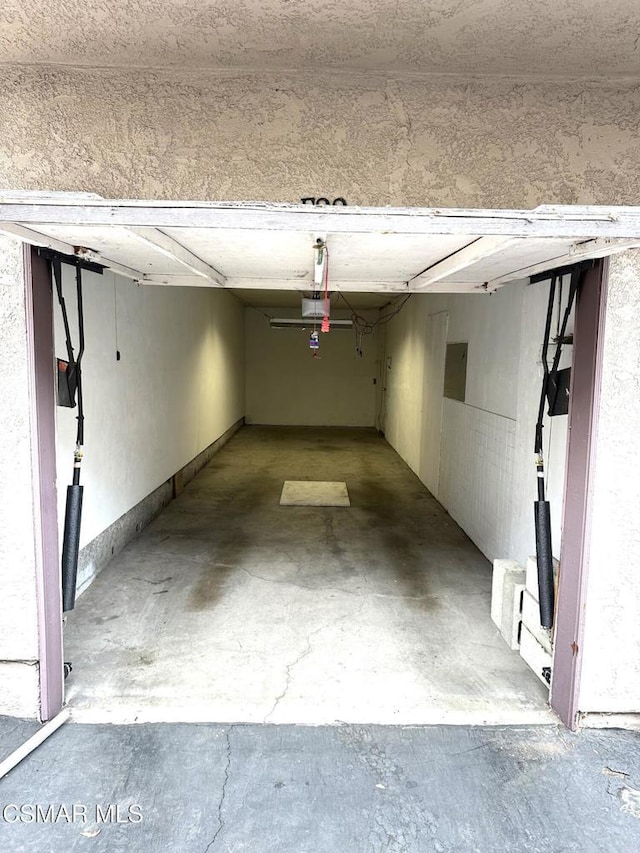 garage featuring a garage door opener