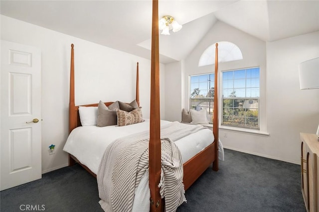 carpeted bedroom with vaulted ceiling