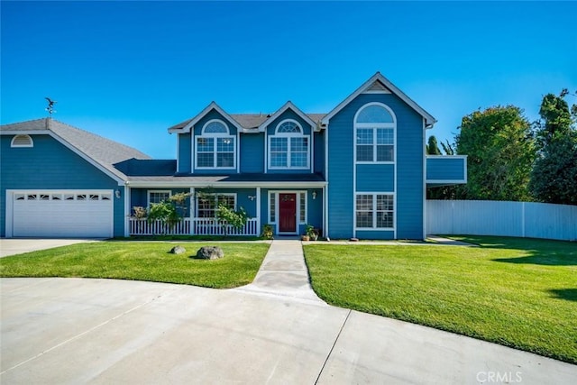 view of front of property featuring a front lawn and a garage