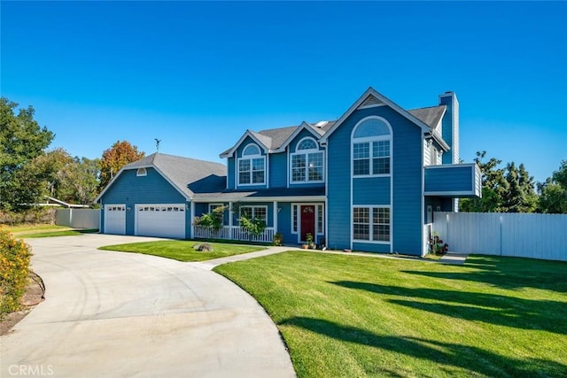 view of front of house featuring a garage and a front lawn