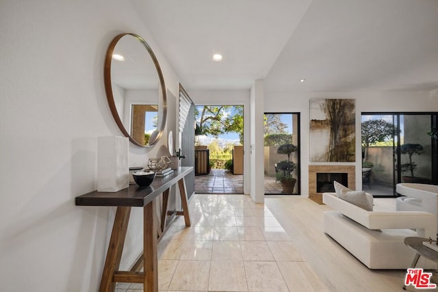 entrance foyer with a fireplace