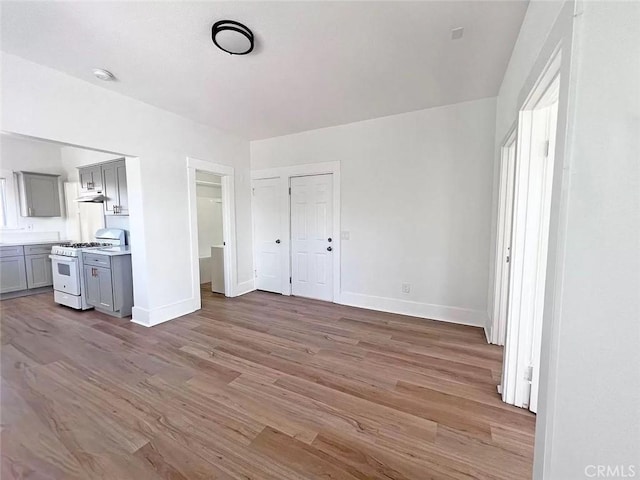 unfurnished bedroom with wood-type flooring