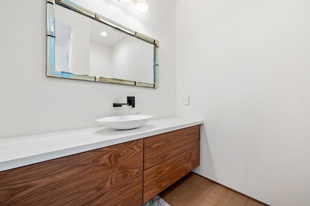 bathroom featuring vanity and wood-type flooring