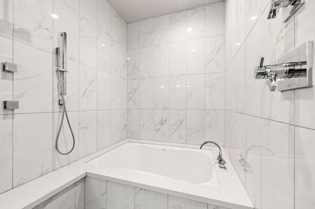 bathroom featuring separate shower and tub