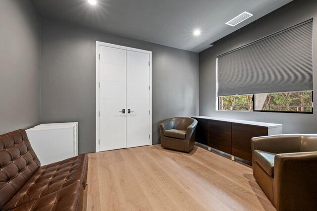 sitting room with light hardwood / wood-style floors