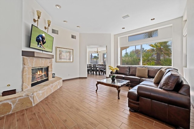 living room with a fireplace and hardwood / wood-style flooring