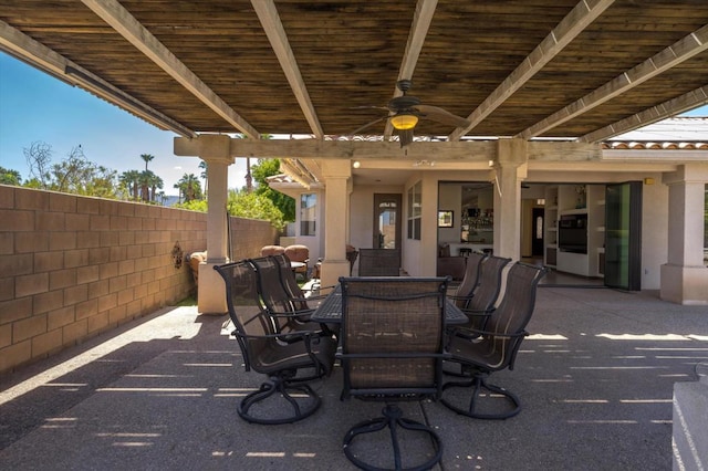 view of patio featuring ceiling fan