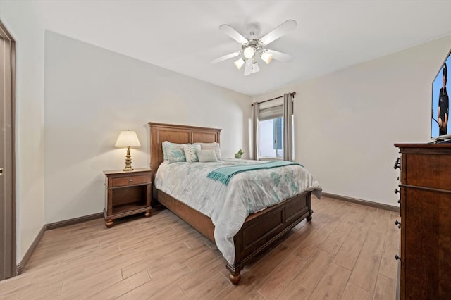 bedroom with ceiling fan and light wood-type flooring