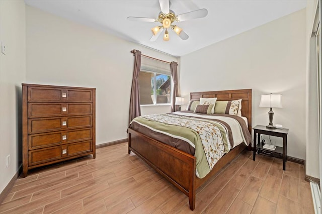 bedroom featuring ceiling fan and light hardwood / wood-style flooring