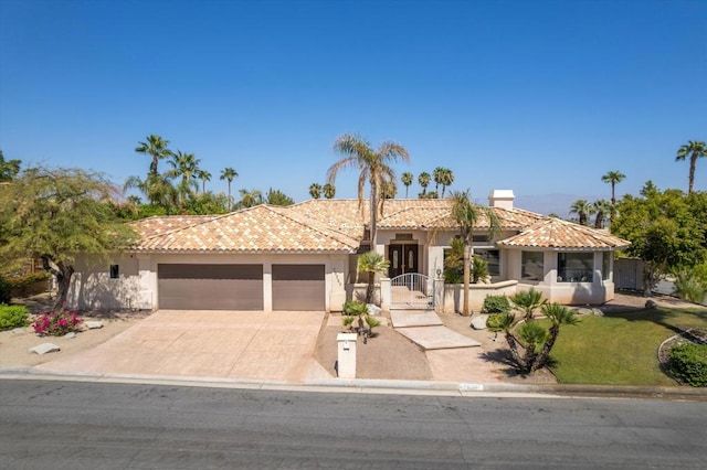 mediterranean / spanish house featuring a garage