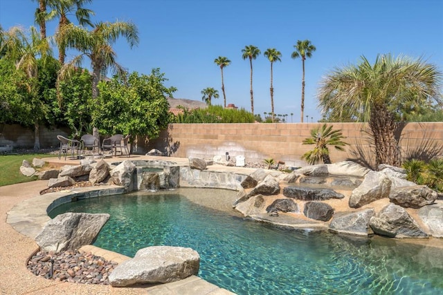 view of pool with pool water feature