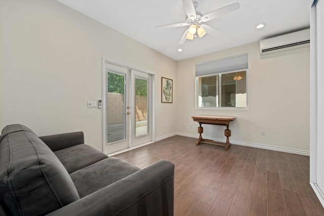 living room featuring ceiling fan, dark wood-type flooring, and a wall mounted AC