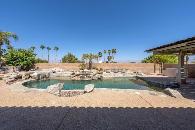 view of swimming pool with a patio area