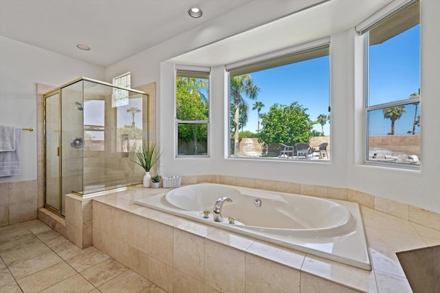 bathroom featuring separate shower and tub and tile patterned floors