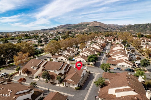 drone / aerial view with a residential view and a mountain view