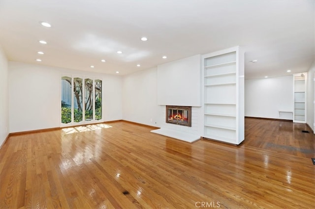 unfurnished living room with hardwood / wood-style floors