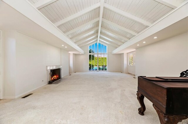 carpeted living room featuring beam ceiling, high vaulted ceiling, and wooden ceiling