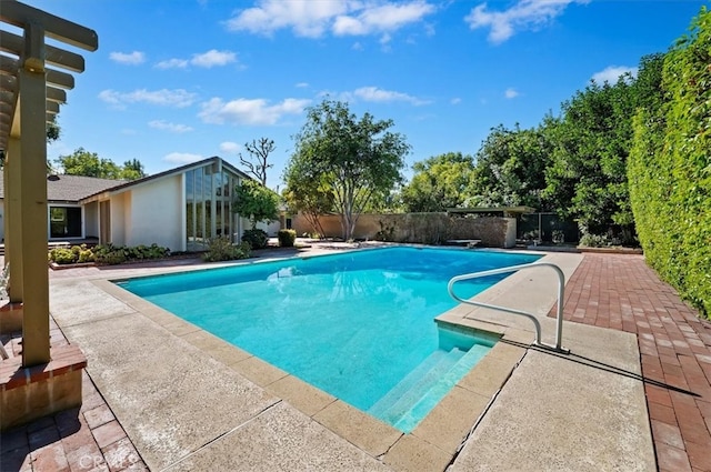 view of swimming pool with a patio