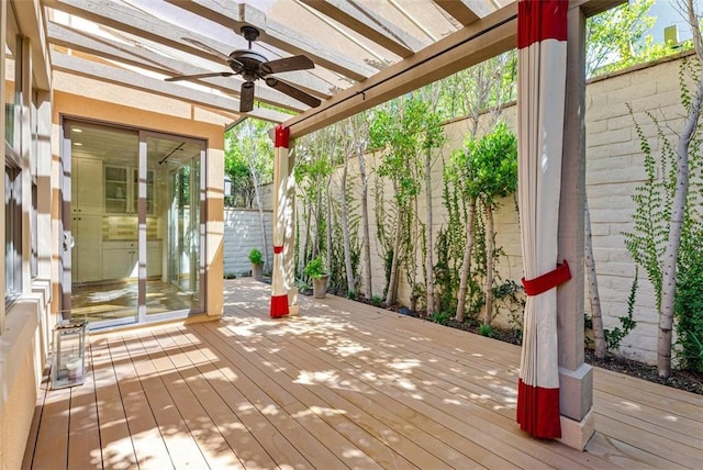 wooden terrace featuring ceiling fan