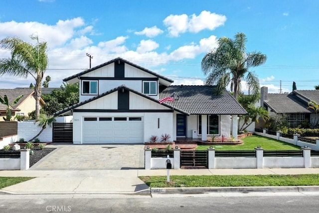 view of front of property featuring a garage and a front lawn