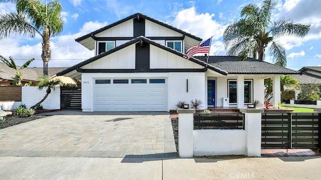 view of front of home with a porch and a garage