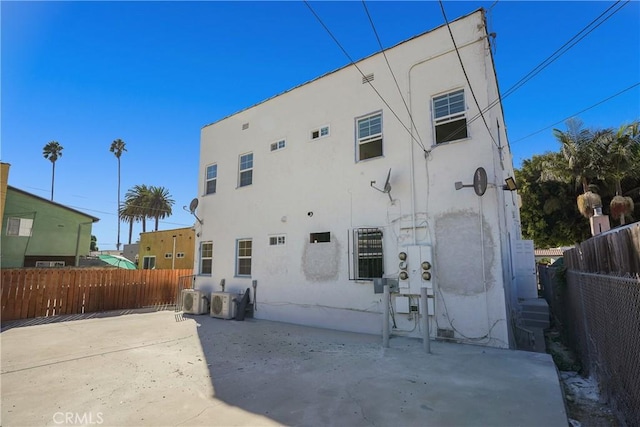 back of house with a patio