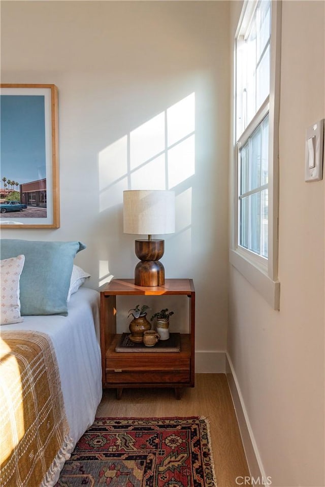 bedroom with hardwood / wood-style floors