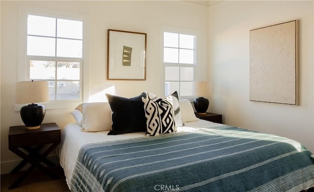 bedroom with multiple windows