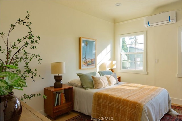 bedroom with a wall mounted air conditioner