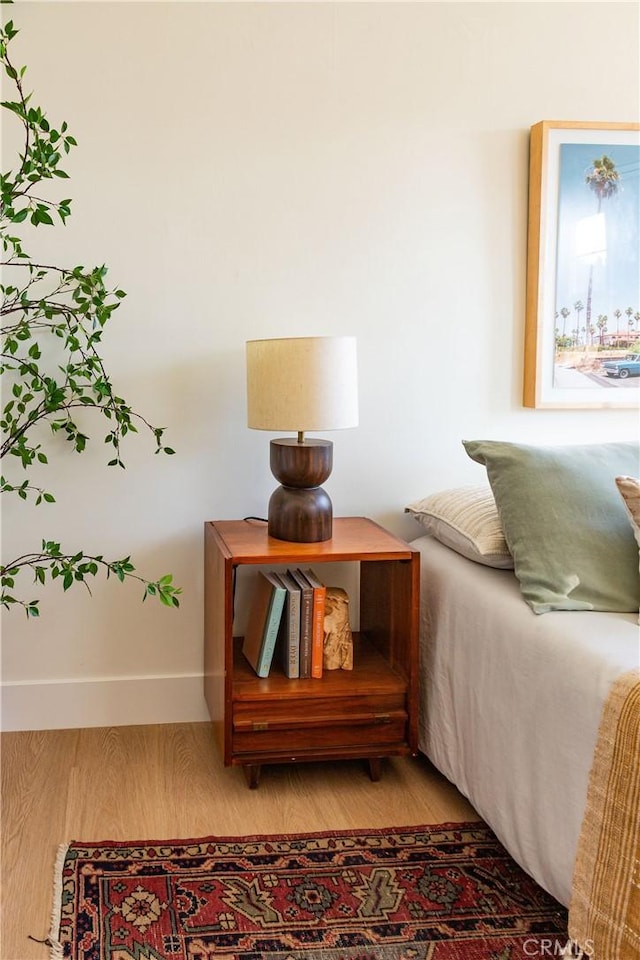 bedroom with hardwood / wood-style flooring