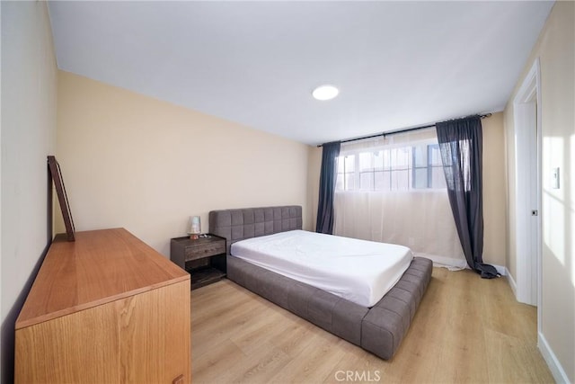 bedroom featuring light hardwood / wood-style floors