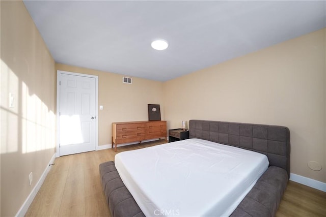 bedroom with light hardwood / wood-style floors