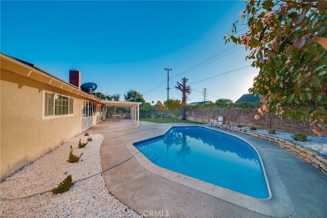 view of swimming pool featuring a patio area