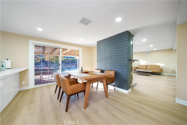 1707 Canard Ave, Placentia, CA 92870 - dining area featuring light wood finished floors, a multi sided fireplace, baseboards, and recessed lighting