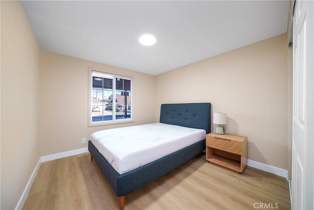 bedroom featuring wood-type flooring