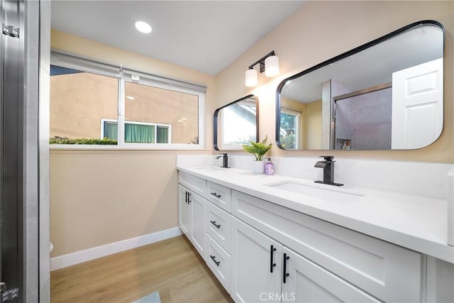 bathroom featuring hardwood / wood-style floors and vanity