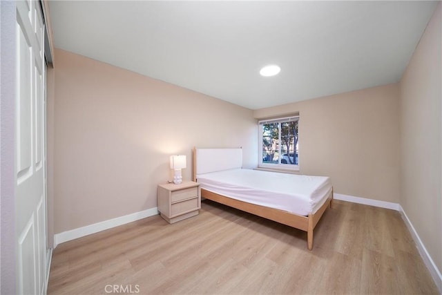 bedroom featuring light wood-type flooring