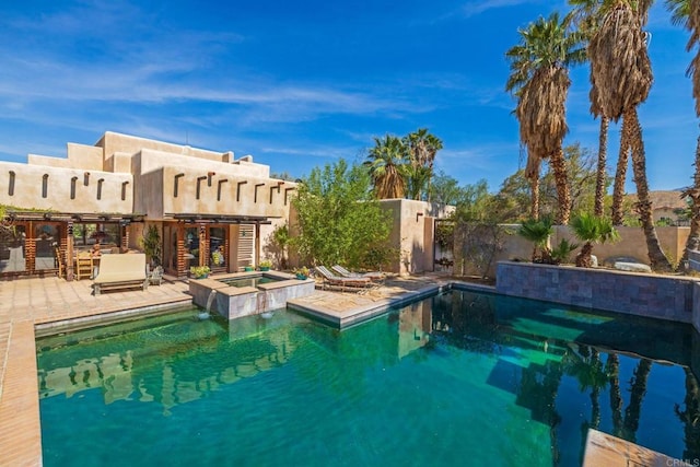 view of pool featuring an in ground hot tub and a patio