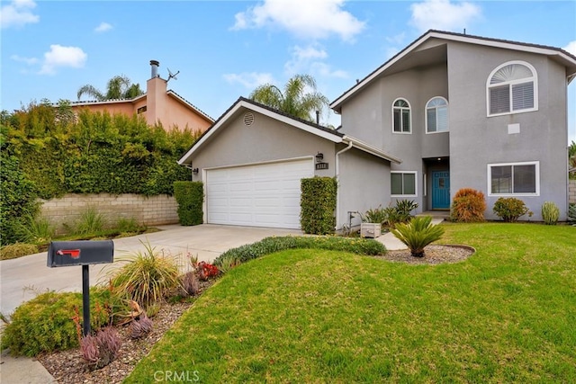 view of front of property featuring a front lawn and a garage