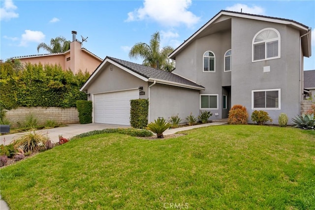 view of front of property with a garage and a front yard