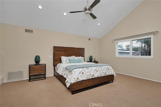 bedroom with ceiling fan, high vaulted ceiling, and light carpet