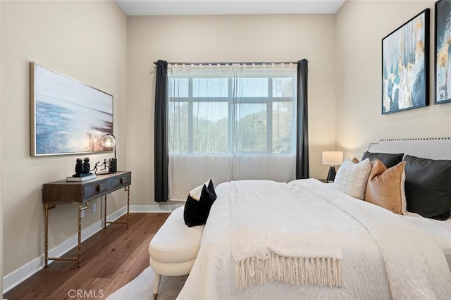 bedroom featuring wood-type flooring