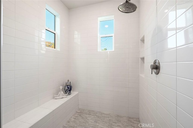 bathroom featuring tiled shower