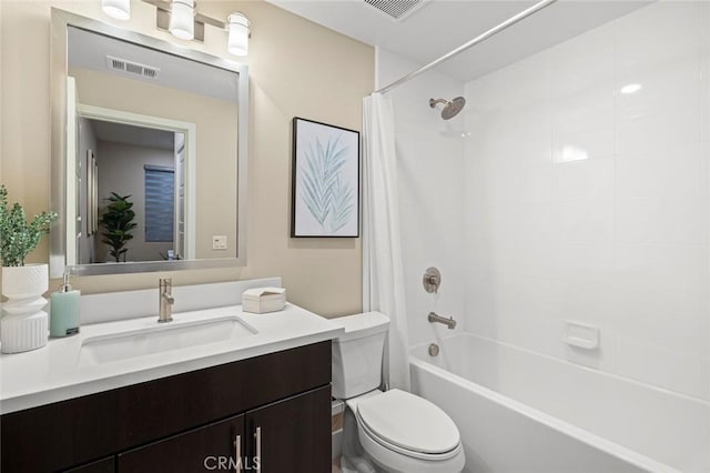 full bathroom with shower / bath combination with curtain, vanity, and toilet