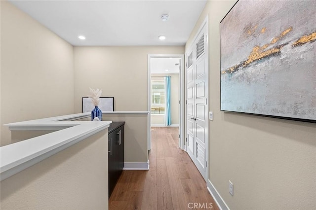 corridor featuring hardwood / wood-style floors