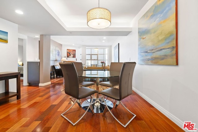 dining room with hardwood / wood-style flooring