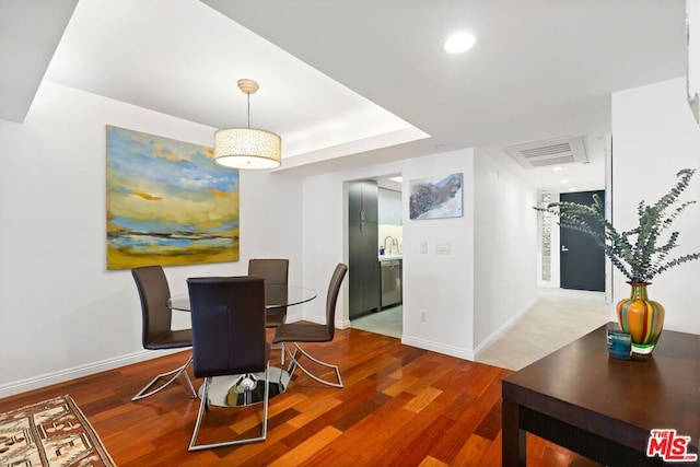 dining area featuring wood-type flooring